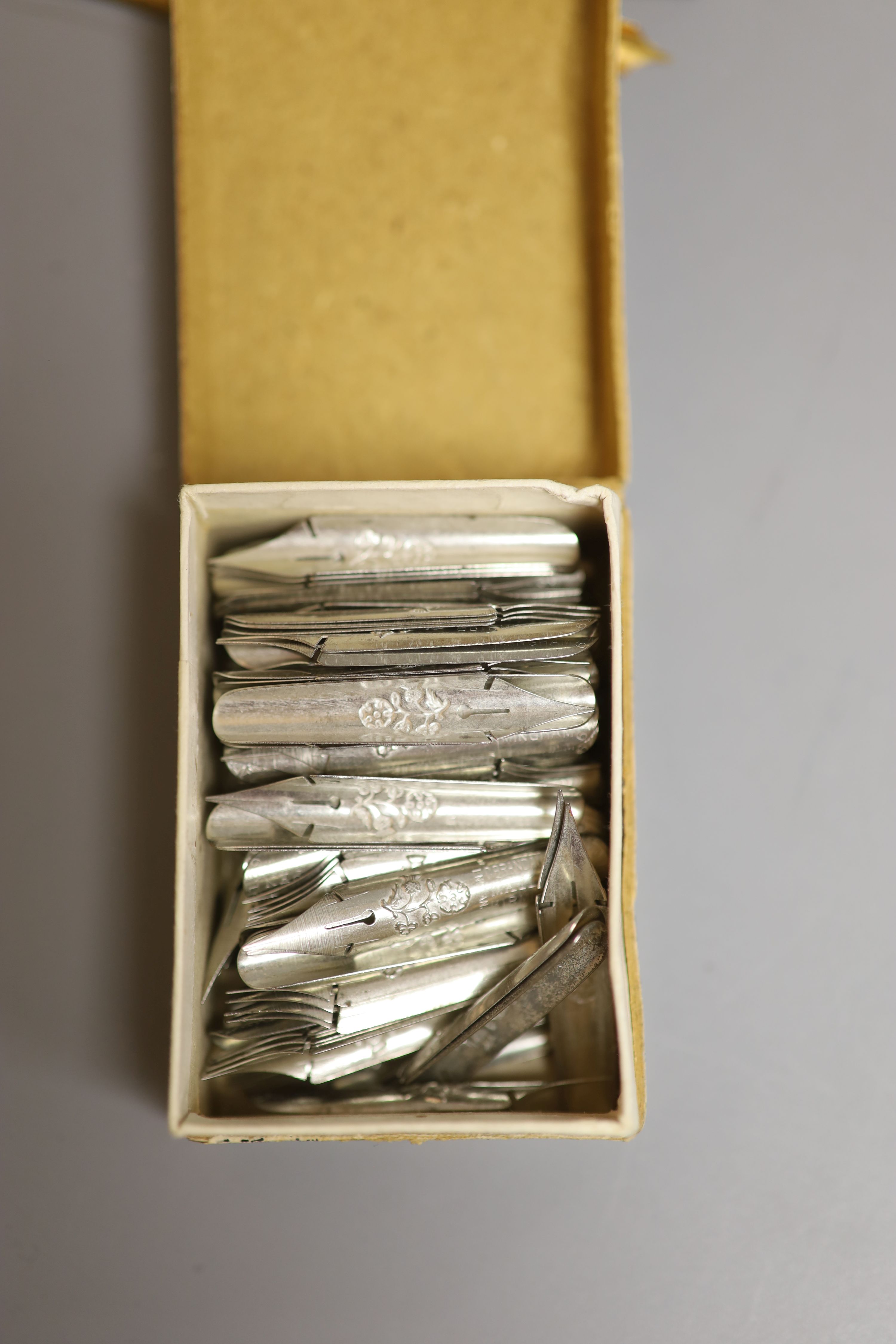 Early pen nib boxes with a larger quantity of dip pen nibs